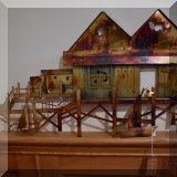 A12. Metal wall art sculpture dock with fishing hut and sailboats. Unsigned. 15”h x 31”w